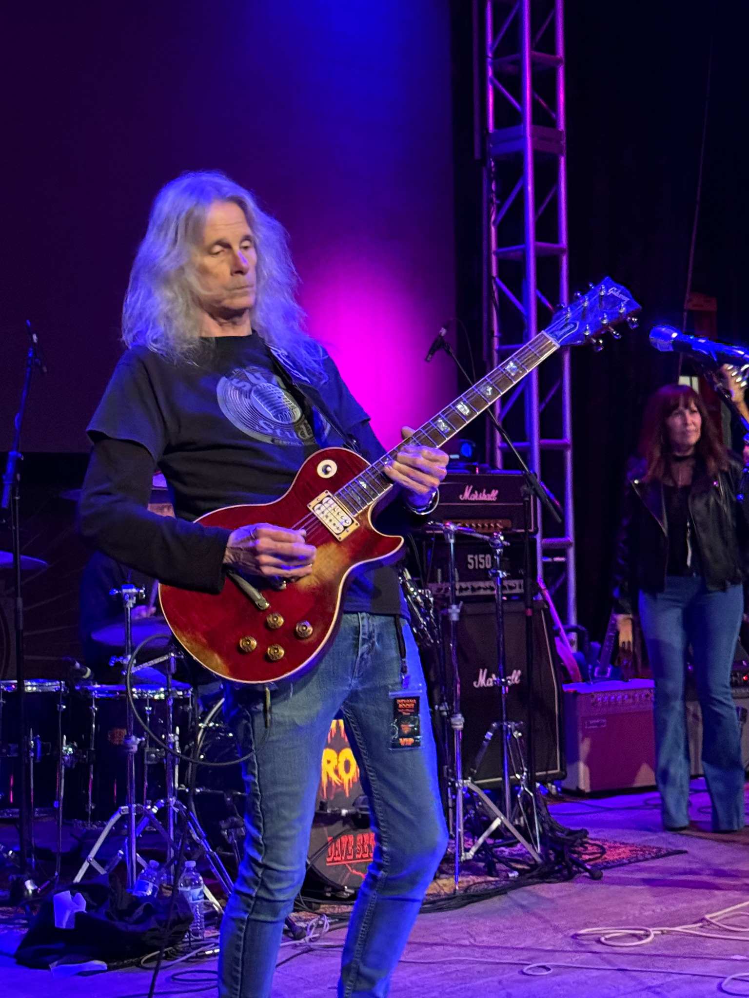 Kevin Silva performing with a red guitar